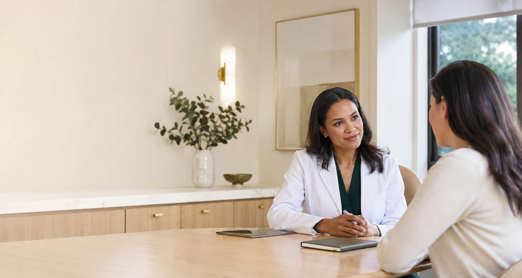 Concierge physician listening to a patient during a private consultation